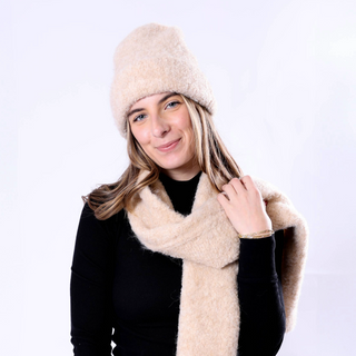 Image 3 (camel hat + scarf set): Woman wearing camel Poppy Hat and scarf, styled with a black top for a chic winter look.
