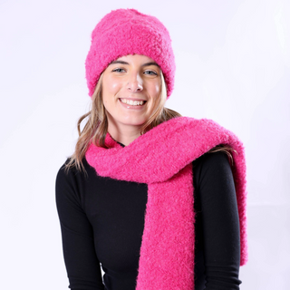 Image 4 (magenta hat + scarf set): Woman in bright magenta Poppy Hat and scarf, making a bold cold-weather statement.