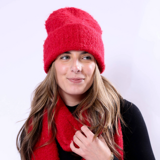 Image 6 (red hat + scarf set): Woman wearing red Poppy Hat and scarf, a vibrant eco-chic winter style.