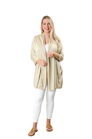 Woman wearing metallic gold colored shawl