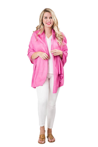 Woman wearing pink orchid colored shawl