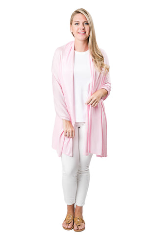 Woman wearing peony pink colored shawl