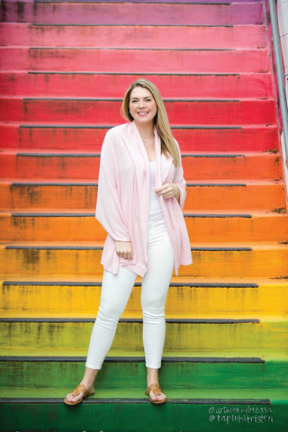 Woman wearing peony pink colored shawl