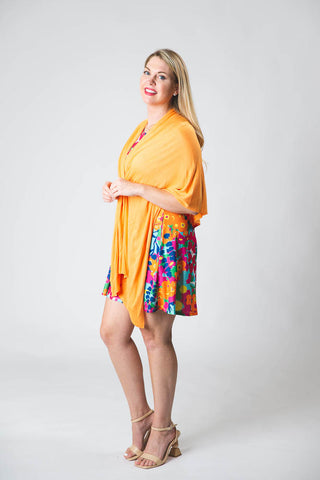 Woman wearing sherbet colored shawl