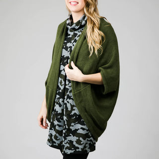Green and gray camouflage print jacquard knit tunic dress with three quarter sleeves, turtleneck and front pleat with knit shrug
