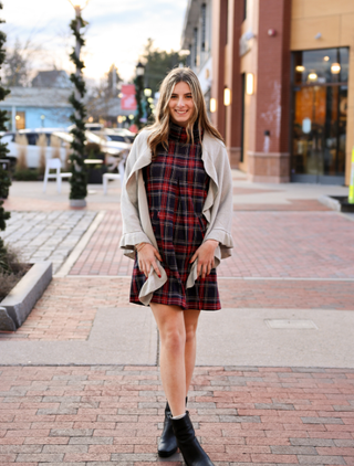 Woman wearing plaid scarf
