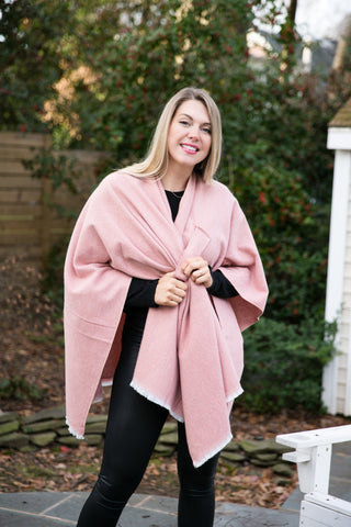 Woman wearing pink oversized wrap with keyhole