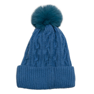 Azure cable knit beanie hat with coordinating pom pom and cream fleece lining.