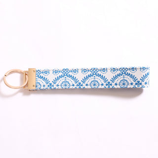 Printed Game Loop keychain in blue lace floral pattern.