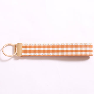 Burnt orange keychain with gold ring
