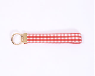 Red and white checkered keychain on a white background