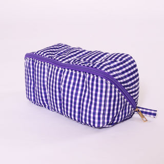 Blue and white gingham fold flat toiletry bag with  zipper
