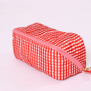Red and white gingham fold flat toiletry bag with  zipper