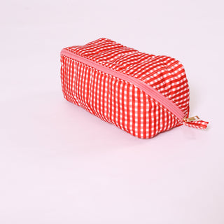 Bright red gingham glam makeup and toiletry bag with zipper.