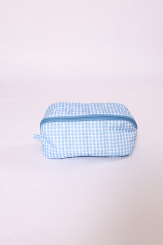 Baby blue gingham glam travel bag with zipper top – lightweight and portable.