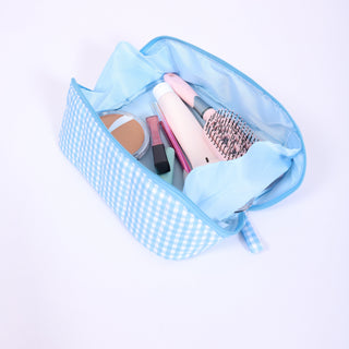 Baby blue gingham glam travel bag with zipper top – lightweight and portable.