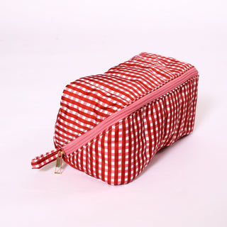 Red and white gingham fold flat toiletry bag with  zipper