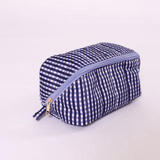Navy and white gingham fold flat toiletry bag with  zipper