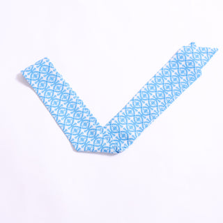Blue patterned twillie with diamond floral motifs, versatile hair and bag accessory.