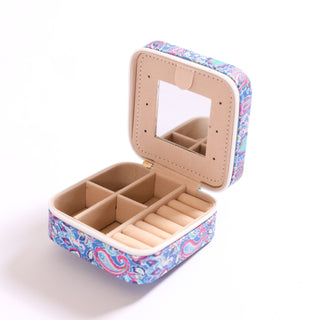 Travel jewelry case with blue and pink paisley print, shown open with mirror and compartments.