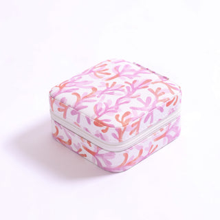 Travel jewelry organizer in pink and orange coral reef-inspired print.
