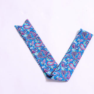 Bright paisley printed twillie scarf in shades of blue, pink, and green.