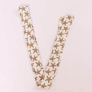 White twillie with gold starfish print, styled for coastal chic accessorizing