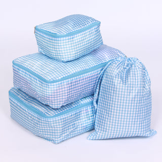 Set of checkered light blue packing cubes