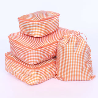 Set of checkered bright orange packing cubes