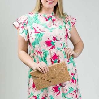 Hibiscus print multi-tiered dress with back button, ruffle neck and ruffle short sleeve, close-up