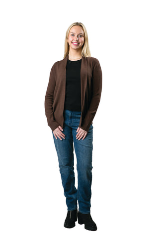 Woman in a brown open front cardigan styled with a black t-shirt and blue jeans