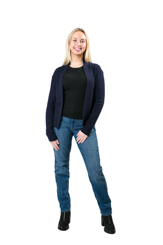 Woman in a navy blue open front cardigan styled with a black t-shirt and blue jeans