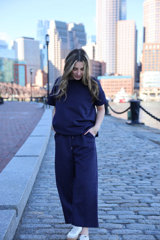 women wearing navy blue matching set 