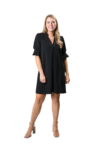 v-neck black dress with puff sleeves and flattering front pleat