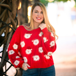 Red sweater with Santa faces