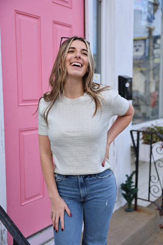 Women wearing silver short sleeve top