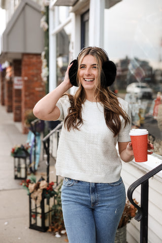 Women wearing silver short sleeve top