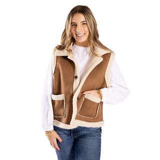 Women wearing camel sherpa and suede vest