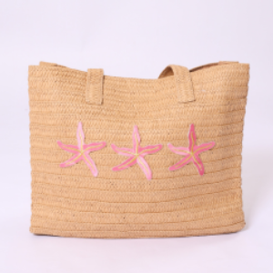 Woven straw bag with pink starfish pattern