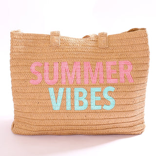 Woven bag with 'Summer Vibes' in pink and blue text