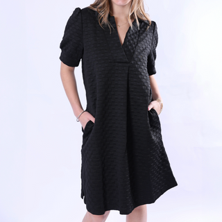black dress with short puffy, banned sleeves and a V-neck with collar