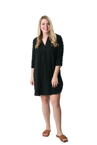 Black Carmella Tunic Dress with feminine swiss dot pom fabric, perfect for summer.