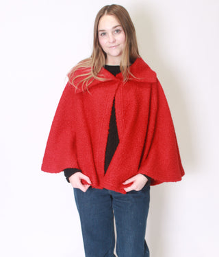 Woman wearing red Kristen Cape 