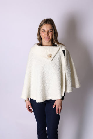 Woman wearing white Kristen Cape 