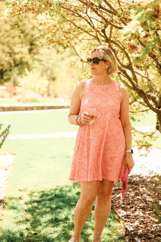 Woman wearing pink and orange dress