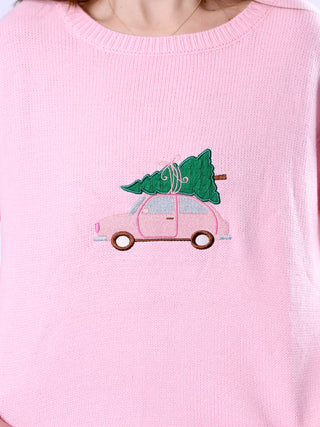 Close-up of buggy and Christmas tree embroidered design on the Pippa Pink Sweater.