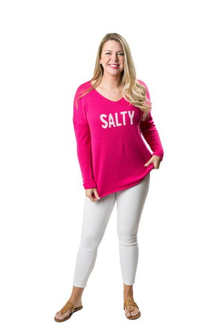 Woman wearing a pink 'SALTY' shirt 