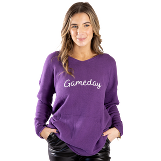 Purple sweater with white gameday lettering and pockets
