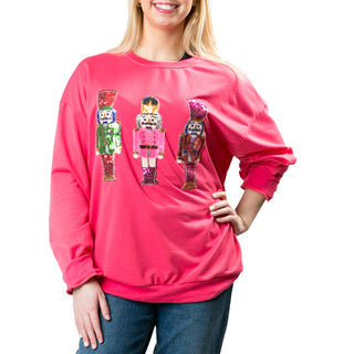 hot pink sweater with nutrcrackers