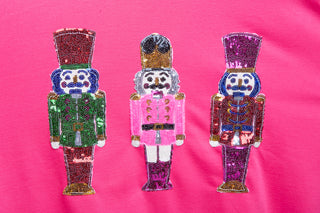 hot pink sweater with nutcrackers